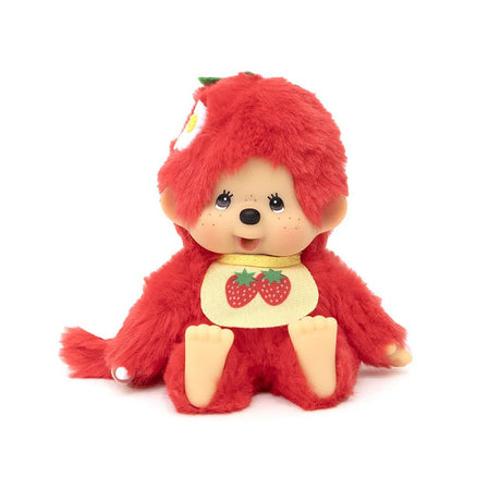 An officially licensed, strawberry red  color , strawberry -themed Monchhichi plush doll has a tan ABS face, brown eyes, freckles, wear a strawberry -print bib, and a green stem detail on its head. Monchhichi plush a soft, fluffy texture. Ideal for collection as a charming gift, or for home decor