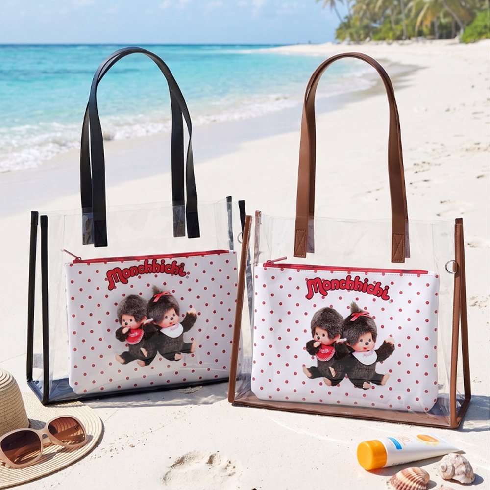 An officially licensed Monchhichi clear tote bag with a removable red polka-dot zippered inner pouch and long shoulder straps, available in black and brown trim