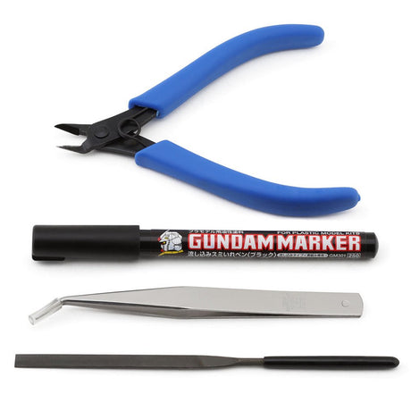 An officially licensed Mr. Hobby Mr. Basic Tool Set for plastic model kits. The set is displayed inside a clear plastic carrying case with a blue interior and includes one pair of blue-handled nippers, a set of angled metal tweezers, a metal file, and a hobby marker.