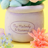 An officially licensed Sanrio plush bouquets featuring My Melody and Kuromi as soft, colorful flowers inside plush pots. The purple planter is beautifully embroidered with character names.
