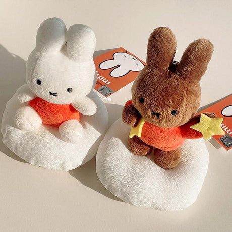 Official Miffy and Melanie Dream Mascot Plush Keychains displayed with a yellow tote bag; featuring white Miffy and brown Melanie in orange outfits holding stars, a nostalgic minimalist Zen bag charm set for adult friendship gifts and office-core aesthetics.