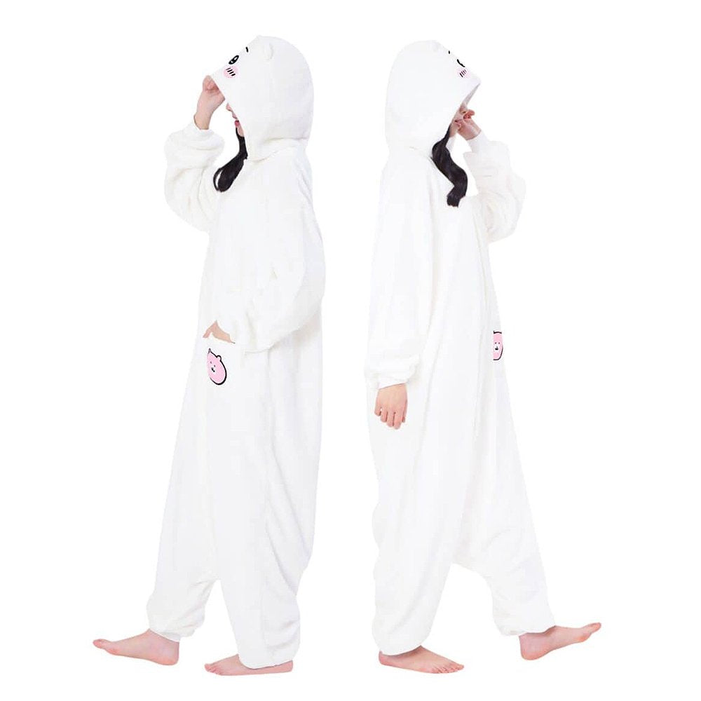 Official SAZAC Chiikawa Kigurumi Vol. 2 Costume Onesie Jumpsuit worn by a model. Features a soft white fleece body, Chiikawa face hood with blush details, and the upgraded pink bear pochette pocket embroidery. Perfect for Halloween costumes, cozy sleepover nights, and cosplay party loungewear for anime fans