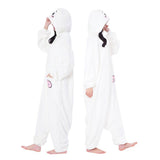 Official SAZAC Chiikawa Kigurumi Vol. 2 Costume Onesie Jumpsuit worn by a model. Features a soft white fleece body, Chiikawa face hood with blush details, and the upgraded pink bear pochette pocket embroidery. Perfect for Halloween costumes, cozy sleepover nights, and cosplay party loungewear for anime fans