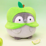Officially licensed Spiralcute Koupen Chan green apple costume plush toy featuring a cute round grey penguin with rosy cheeks, soft fleece texture, and a felt leaf stem on its head, serving as a comforting desktop healing companion for adult and kidult collectors.