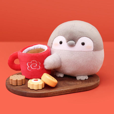 Cozy office-core deskterior Koupen Chan plush with a plush red mug. An aesthetic workplace healing accessory for adult collectors, perfect for creating a soothing desk setup and enhancing mental wellness during coffee breaks.