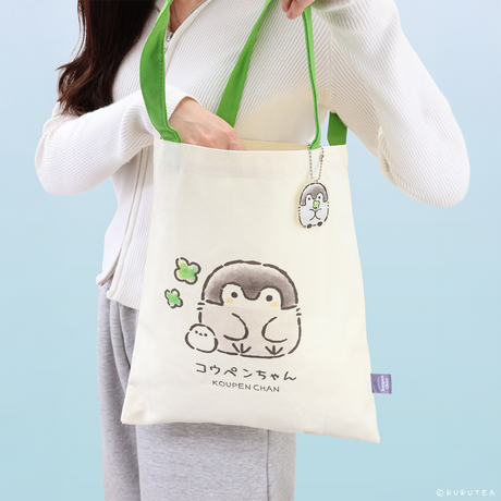 Official Spiralcute Koupen Chan Canvas Tote Bag featuring a cute clover illustration. Decorated with a matching Koupen Chan acrylic keychain, this aesthetic tote is ideal for spring outings, casual picnics, and cottage-core or k-fashion inspired outfits.
