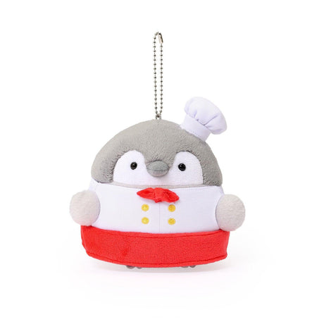 Officially licensed Spiralcute Koupen Chan Bakery Series plush mascot keychain featuring the cute grey penguin wearing a white patissier uniform with yellow buttons, a red bow tie, a red apron, and a tilited white baker hat, with a silver ball chain, made of soft fuzzy material for adult kidult collectors as a kawaii aesthetic bag accessory or collectible plush charm.