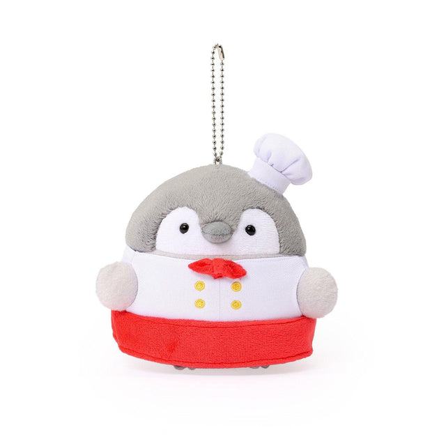Officially licensed Spiralcute Koupen Chan Bakery Series plush mascot keychain featuring the cute grey penguin wearing a white patissier uniform with yellow buttons, a red bow tie, a red apron, and a tilited white baker hat, with a silver ball chain, made of soft fuzzy material for adult kidult collectors as a kawaii aesthetic bag accessory or collectible plush charm.