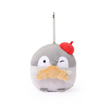 Officially licensed Spiralcute Koupen Chan Bakery Series plush mascot keychain featuring the cute grey penguin wearing a bright red artist beret hat and holding a croissant, with a silver ball chain, made of soft fuzzy material for adult kidult collectors as a kawaii aesthetic bag accessory or collectible plush charm.