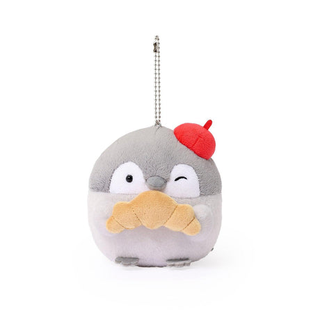 Officially licensed Spiralcute Koupen Chan Bakery Series plush mascot keychain featuring the cute grey penguin wearing a bright red artist beret hat and holding a croissant, with a silver ball chain, made of soft fuzzy material for adult kidult collectors as a kawaii aesthetic bag accessory or collectible plush charm.