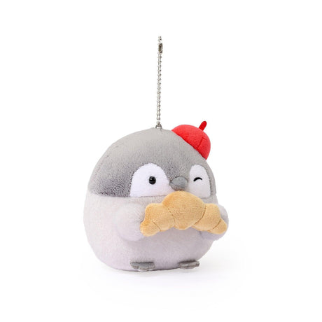 Officially licensed Spiralcute Koupen Chan Bakery Series plush mascot keychain featuring the cute grey penguin wearing a bright red artist beret hat and holding a croissant, with a silver ball chain, made of soft fuzzy material for adult kidult collectors as a kawaii aesthetic bag accessory or collectible plush charm.