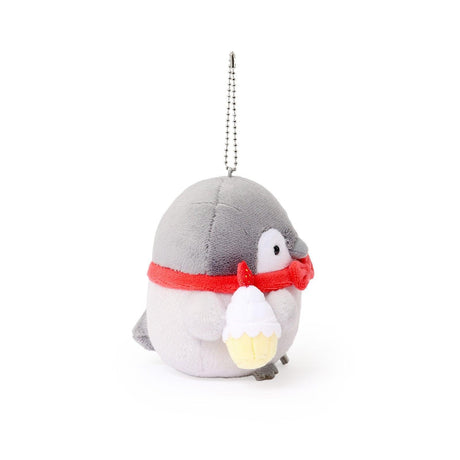 Officially licensed Spiralcute Koupen Chan Bakery Series plush mascot keychain featuring the cute grey penguin wearing a bright red bow tie and holding a miniature strawberry cupcake, with a silver ball chain, made of soft fuzzy material for adult kidult collectors as a kawaii aesthetic bag accessory or collectible plush charm.