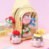 Official Spiralcute Koupen Chan fruit mascot keychains styled in a yellow Ita-bag (clear window backpack). This visual demonstrates a creative way to display your collection on backpacks or school bags, perfect for Y2K aesthetic and "Bag Decorating" enthusiasts.