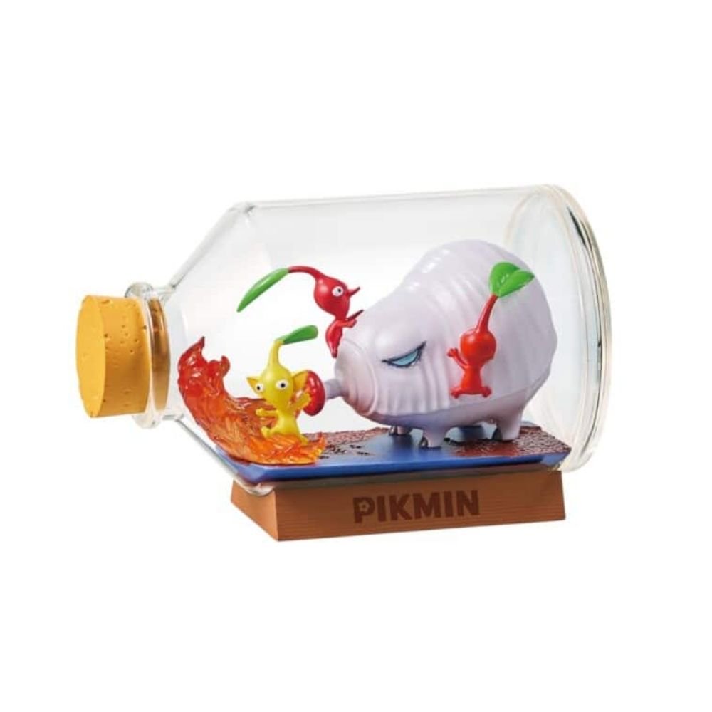 Officially licensed Re-Ment Pikmin Terrarium Collection Figure featuring one Red, one Blue, and one Yellow Pikmin. The Blue and Red Pikmin carry large berries inside a horizontal clear bottle with a cork stopper, resting on a rocky diorama base near a miniature fire element.