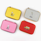 Officially licensed Peanuts hard shell pencil cases in yellow, red, pink, and grey featuring Snoopy, Charlie Brown, and friends
