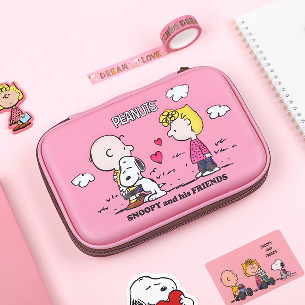Officially licensed Peanuts hard shell pencil cases in yellow, red, pink, and grey featuring Snoopy, Charlie Brown, and friends