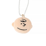 Officially licensed Peanuts plush keychain featuring the face of Charlie Brown attached to a white ball chain.