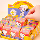 A collection of 12 different Peanuts character acrylic keychains in "Luck For You" blind boxes. The keychains feature Snoopy, Woodstock, Charlie Brown, Lucy, Linus, and Sally.