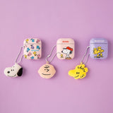 Officially licensed Peanuts plush keychains featuring the faces of Snoopy, Charlie Brown, and Woodstock attached to a white ball chain.