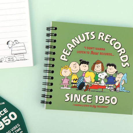 An overhead shot showing officially licensed Peanuts spiral notebook in green, showcasing the different vintage-inspired cover design and black spiral binding.