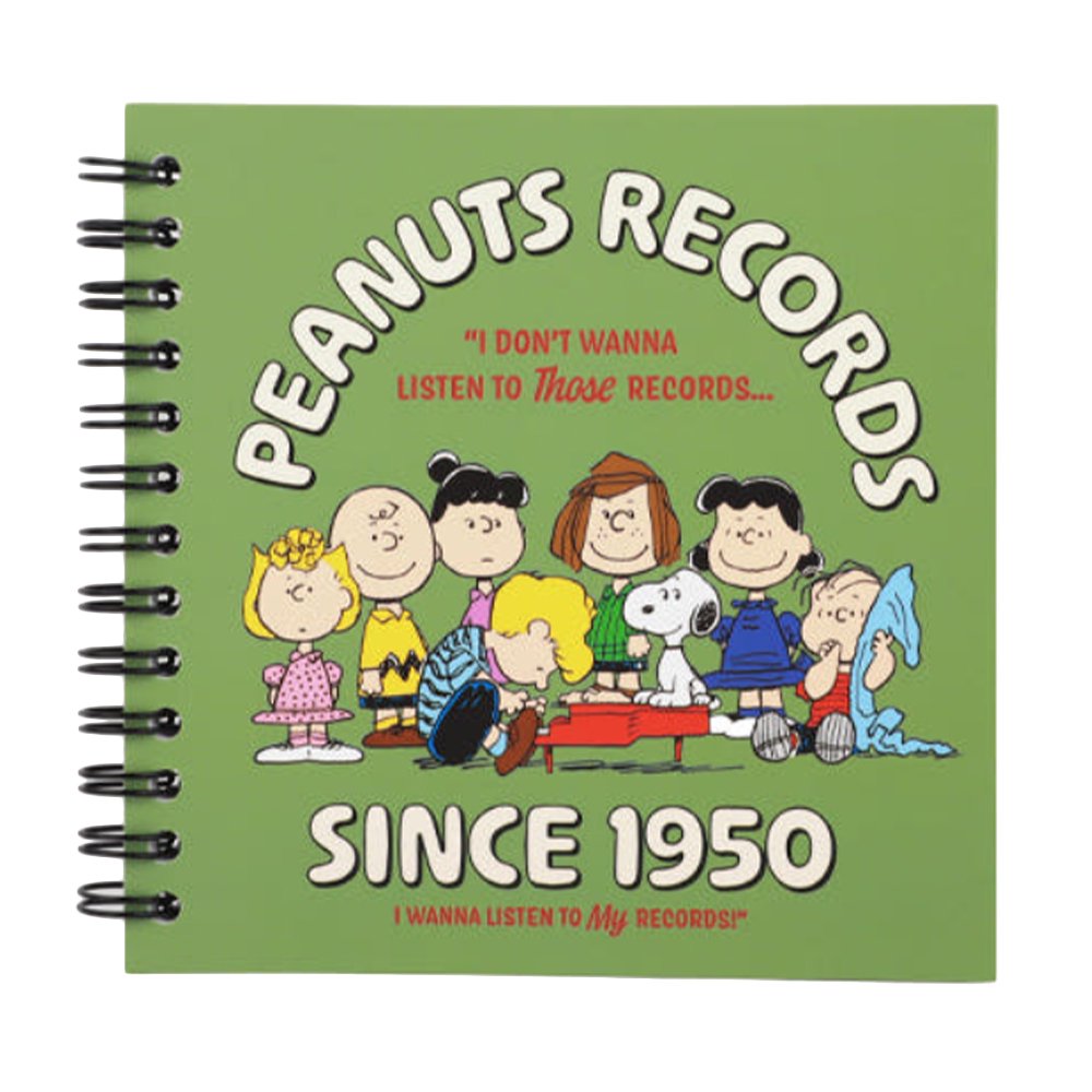 An overhead shot showing officially licensed Peanuts spiral notebooks in green, showcasing the different vintage-inspired cover design and black spiral binding.