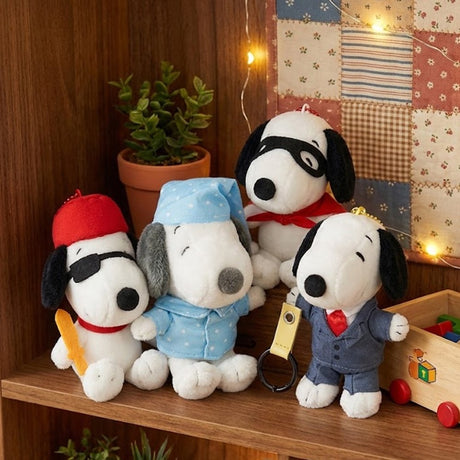An officially licensed collection of Peanuts Plush Snoopy keychains in a variety of poses and holding props, including ice cream, wearing a cape, and holding art supplies.