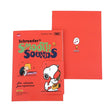 Two officially licensed Peanuts notebooks in red and blue featuring Snoopy and Charlie Brown. The image demonstrates the unique "wing" cover flaps being used as bookmarks and page markers within the lined journal pages.