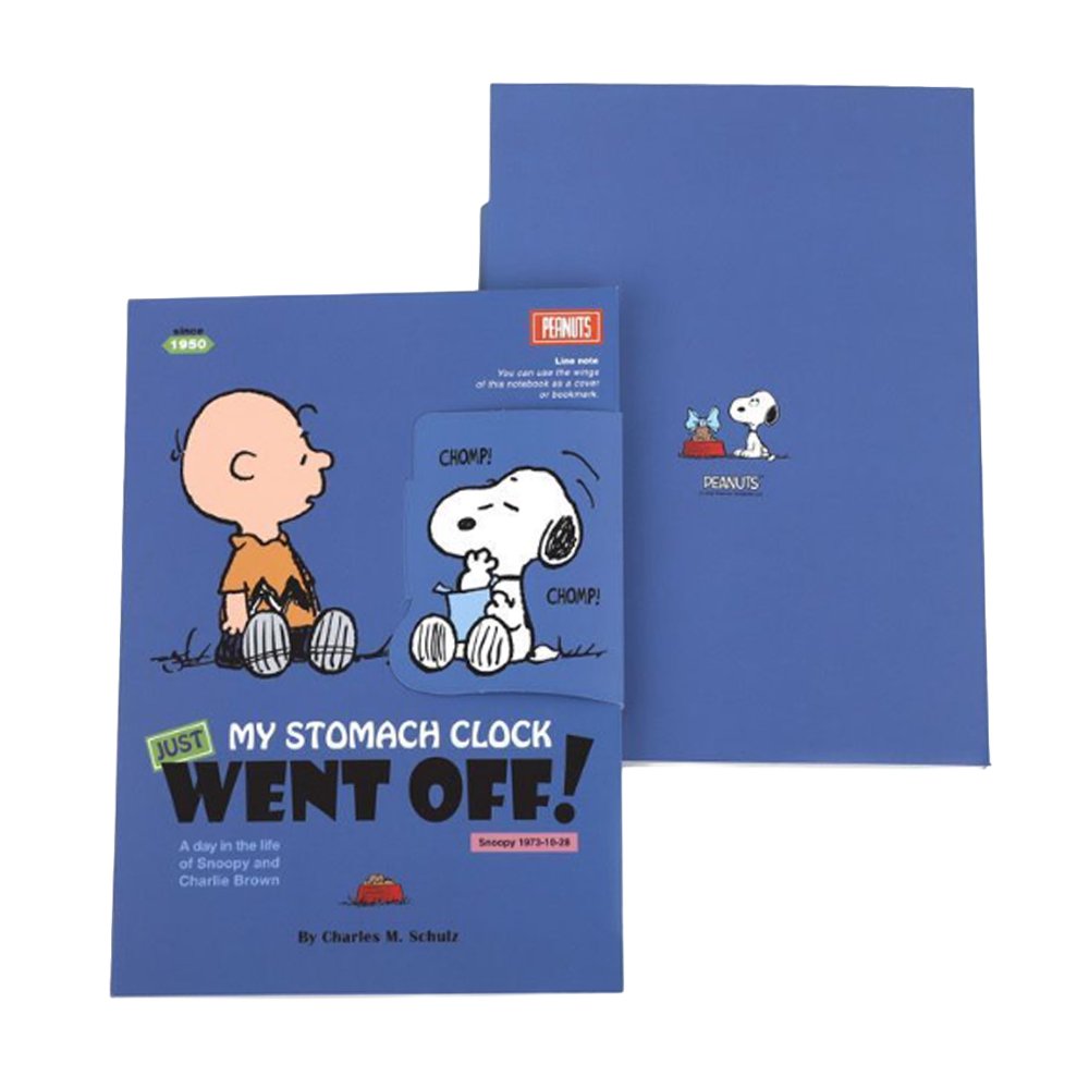 Two officially licensed Peanuts notebooks in red and blue featuring Snoopy and Charlie Brown. The image demonstrates the unique "wing" cover flaps being used as bookmarks and page markers within the lined journal pages.