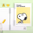 Three officially licensed Peanuts line notebooks with translucent covers in soft hues of pink, yellow, and green, each featuring a large illustration of Snoopy. The interior view shows 8mm ruled pages with small Snoopy graphics at the top and bottom corners.
