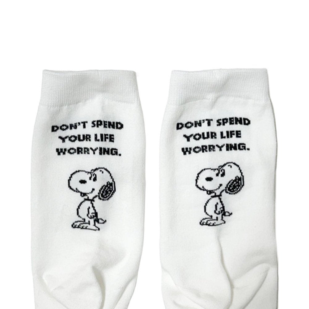 A set of three crew-length socks in white, beige, and black, celebrating Snoopy's 75th anniversary. Features clean, line-art illustrations of Snoopy and Woodstock in their most recognizable poses.
