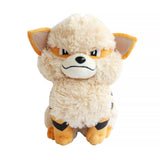 An officially licensed Pokemon plush toy of the Fire-type Arcanine, featuring its distinctive black jagged stripes, a giant fluffy cream-colored mane and chest, and a confident embroidered expression showing a single fang.