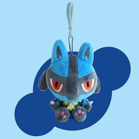 Pokemon Cutie-Pop Lucario Clip-On Plush Bag Charm Plush toy  with blue and gray fur, red eyes, and a yellow belly on a blue background.