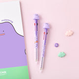 An officially licensed purple Pokemon 3-color ballpoint pens featuring a 3D Ditto character topper and a 0.7mm tip, decorated with various Ditto expressions on the barrel.
