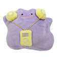 An officially licensed Pokemon Ditto plush in light purple, wearing bright yellow headphones and a matching yellow plush music player around its neck