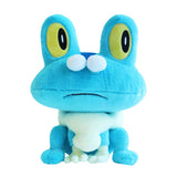 An officially licensed Pokemon plush toy of the Water-type starter Froakie, featuring oversized yellow embroidered eyes, a fluffy white cloud-like collar, and small cream-colored webbed hands resting on the ground.