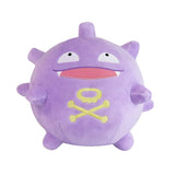 An officially licensed Pokemon Koffing plush toy with a spherical, purple body, wide-open mouth displaying small fangs and a red inner tongue, vacant white eyes, and a prominent yellow skull-and-crossbones emblem on its lower belly
