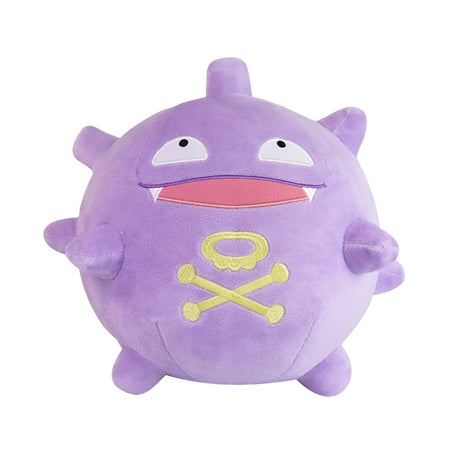 An officially licensed Pokemon Koffing plush toy with a spherical, purple body, wide-open mouth displaying small fangs and a red inner tongue, vacant white eyes, and a prominent yellow skull-and-crossbones emblem on its lower belly