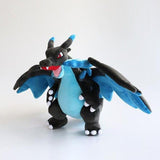 Office Licensed. Pokemon Mega Charizard plush toy of a dragon-like creature with blue wings and black body on a white background. Perfect for  displaying, or gifting Christmas to Pokemon fans of all ages.
