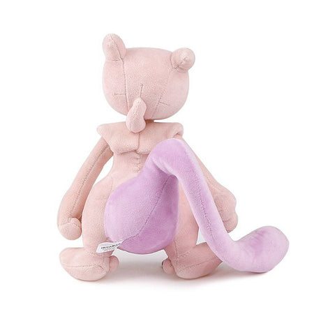 A soft plush toy of the Pokémon Mewtwo, featuring its light purple body, darker purple belly, and long tail, standing upright on a white background