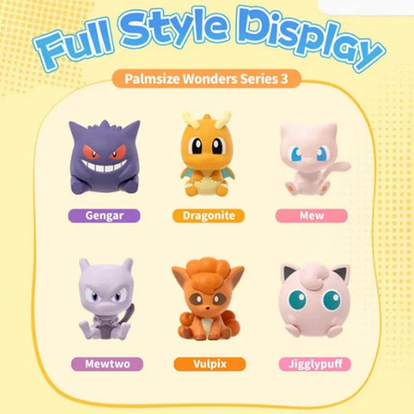 Officially licensed Pokemon Palmsize Wonders Vol. 3 Poke Ball mystery capsules arranged in a display box alongside stylized mini figures of Gengar, Dragonite, Mew, Mewtwo, Vulpix, and Jigglypuff