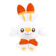 An officially licensed Pokemon plush toy of the Fire-type starter Scorbunny, featuring long ears with orange tips, large embroidered eyes, a yellow bandage-like marking on its nose, and bright orange feet.