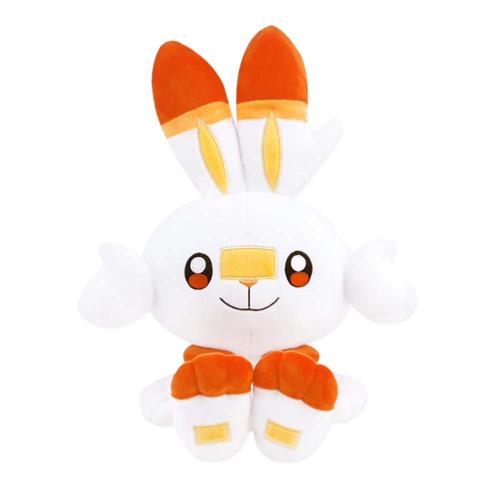 An officially licensed Pokemon plush toy of the Fire-type starter Scorbunny, featuring long ears with orange tips, large embroidered eyes, a yellow bandage-like marking on its nose, and bright orange feet.