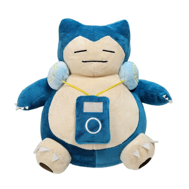 An officially licensed Pokemon Snorlax plush sitting comfortably while wearing light blue headphones and a matching blue plush music player