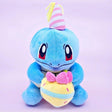Officially licensed Pokemon plush Squirtle wears a charming party hat topped with a bright yellow tassel, and holing a cake for celebrating a special day