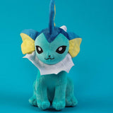 Pokemon Vaporeon Plush toy with blue and yellow design on a teal background