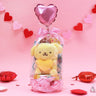 Official Sanrio Pompompurin Valentine's Day Plush Gift Set in a clear ribbon package with a red heart balloon. Includes a small Pompompurin holding a pink heart and a collectible themed box, perfect for Kawaii aesthetic gift ideas.