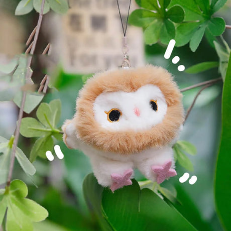 A round, fluffy Barn Owl bird plush keychain with a white face, tan ruff, and pink star-shaped feet