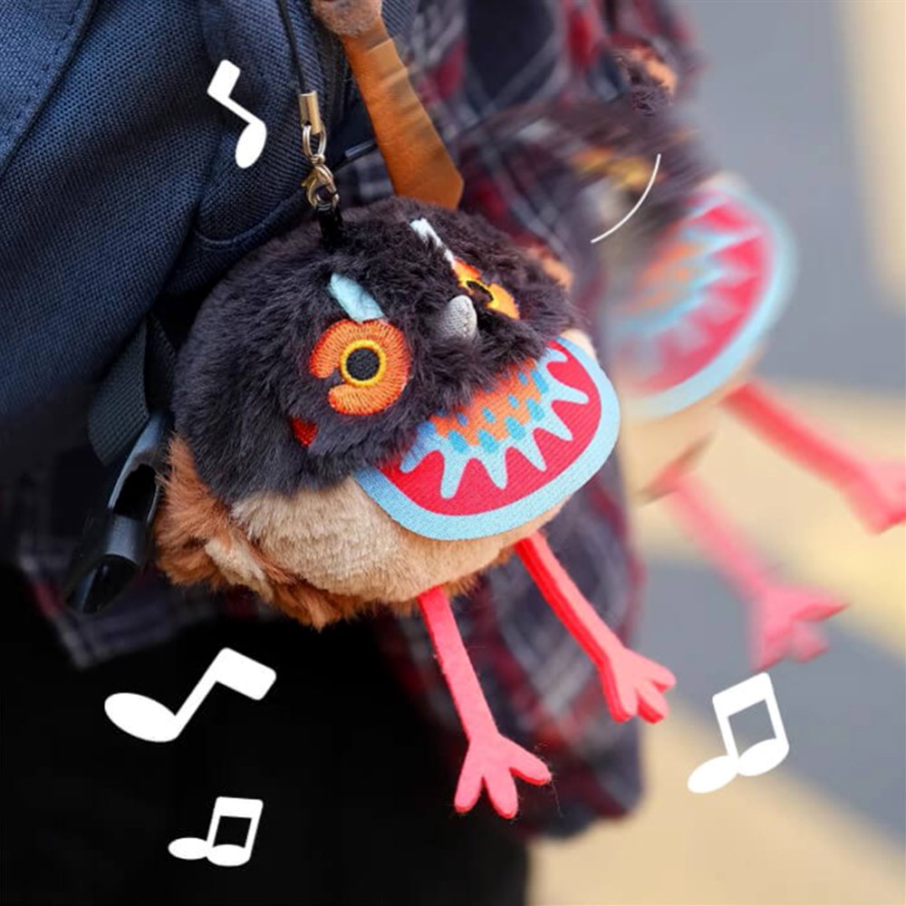 A round Cabot's Tragopan bird plush keychain with dark grey and brown fur, featuring bright orange embroidered eyes and long red legs