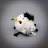 A round, fluffy white Chinese Crested Tern bird plush keychain with a spiky black crest, speckled body details, and a yellow-tipped beak