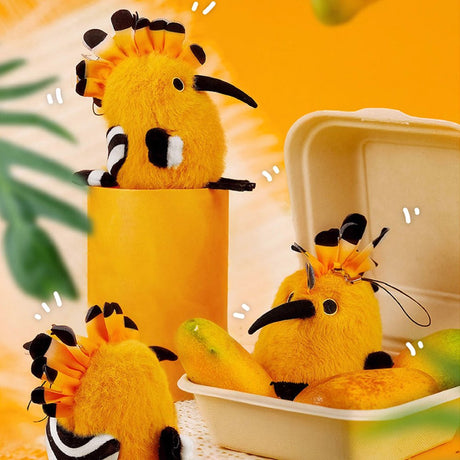 A round, fluffy golden-yellow Eurasian Hoopoe bird plush keychain with a tall orange and black crest, a long black beak, and small black feet